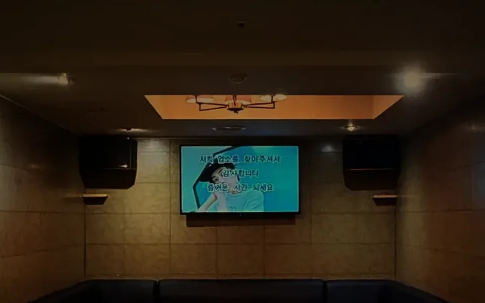 VVIP room at Running Rabbit, Gangnam: navy leather seating facing the karaoke screen